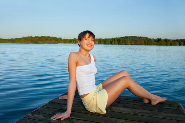 Young woman doing yoga exercise outdoors — Stock Photo, Image