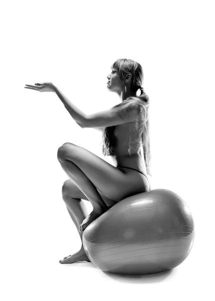 Beatiful nude woman sitting on ball — Stock Photo, Image