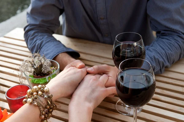 Man and women hands with vine — Stock Photo, Image