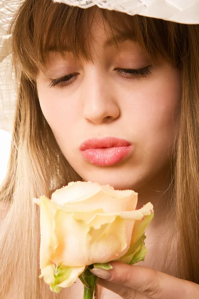 Blonde woman with tea rose — Stock Photo, Image