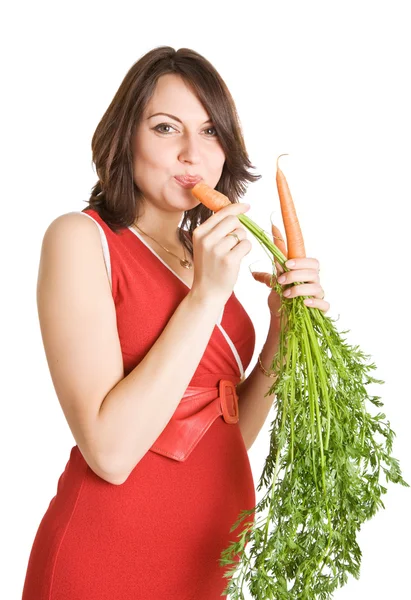 Mujer embarazada con zanahorias frescas — Foto de Stock
