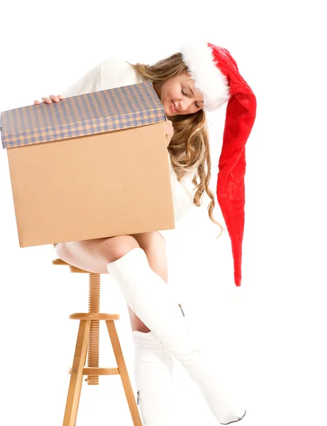 Attractive girl in Santa hat with fancy box — Stock Photo, Image