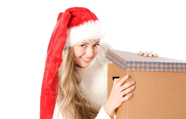 Aantrekkelijk meisje in kerstmuts met luxe doos — Stockfoto