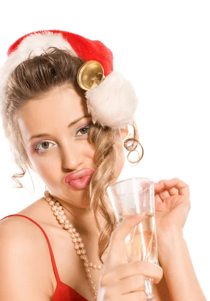 Menina atraente em chapéu de Santa com copo de champanhe — Fotografia de Stock