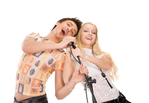 Attractive young couple singing — Stock Photo, Image