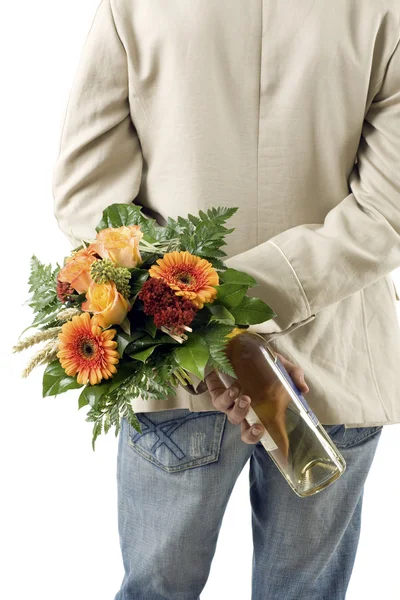 Handsome young groom with a bouquet — Stock Photo, Image