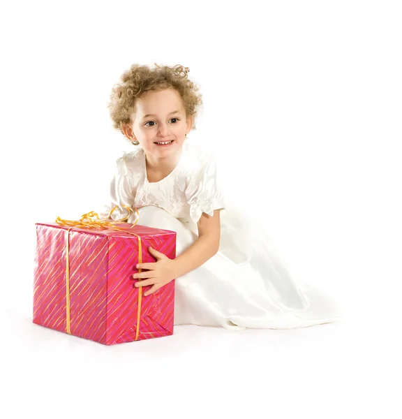Happy little girl with a gift — Stock Photo, Image