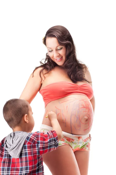 Беременная женщина и маленький мальчик — стоковое фото