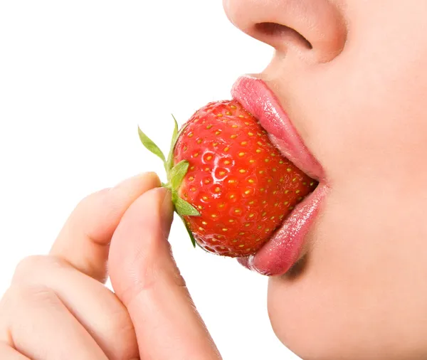 Closeup of a young girl mouth with a strawberry — Stock Photo, Image