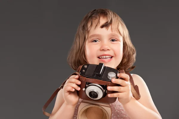 Little girl with a old camera — Stock Photo, Image