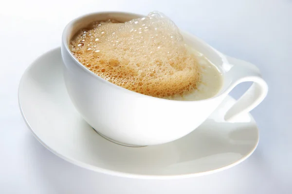Hot coffee with froth — Stock Photo, Image