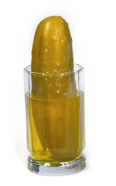 Pickle in glass of pickle juice Royalty Free Stock Photos
