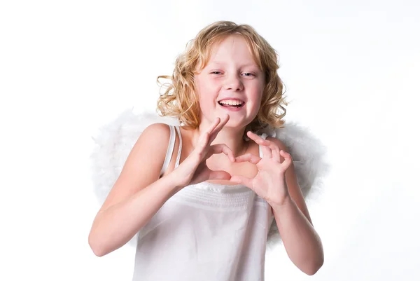 Άγγελος σγουρά κορίτσι κάνει μια καρδιά — Φωτογραφία Αρχείου