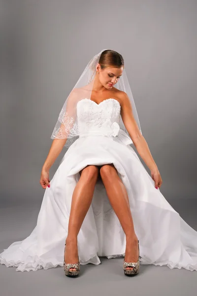 Attractive bride sitting on studio — Stock Photo, Image