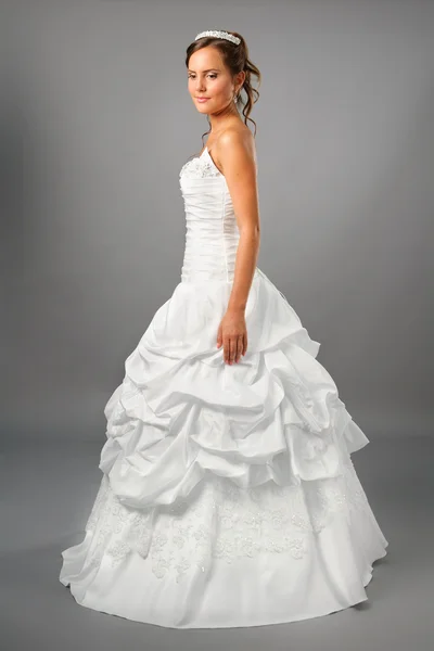 Beautiful bride wearing wedding dress in studio — Stock Photo, Image