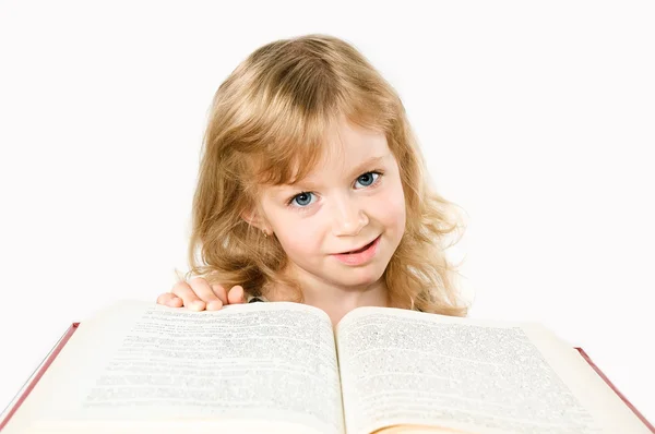 Menina estudante inteligente com um grande livro isolado em branco — Fotografia de Stock