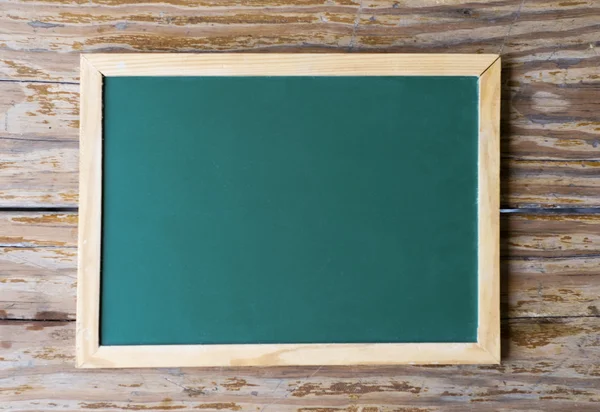 Stock image Blackboard on weathered wood