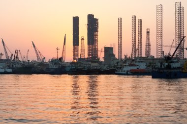 Oil rigs at sunset, Sharjah, Uae clipart