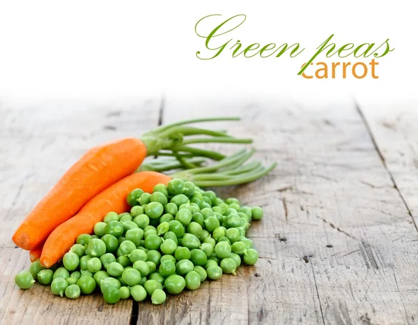 Carrots and green peas — Stock Photo, Image