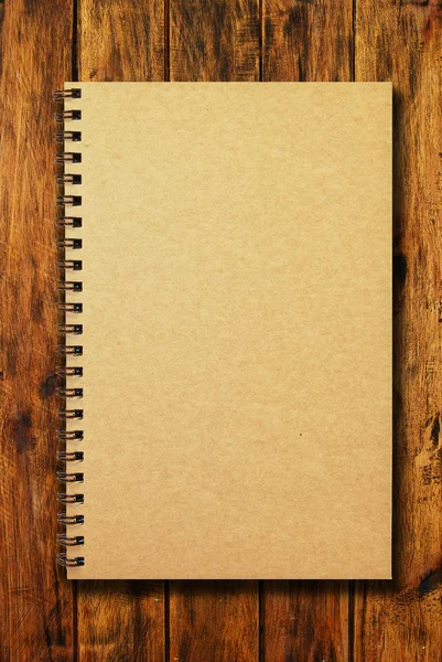 Grunge brown cover notebook on wrinkled paper background — Stock Photo