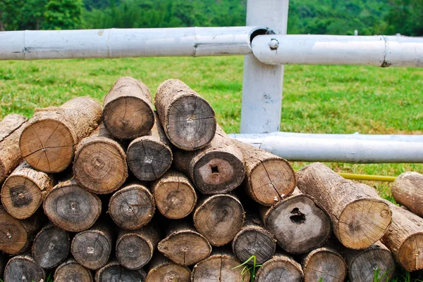 Pile of circular timber in farm land — Stock Photo, Image