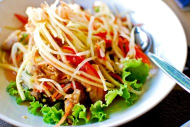 Thai style food , spicy papaya salad clipart