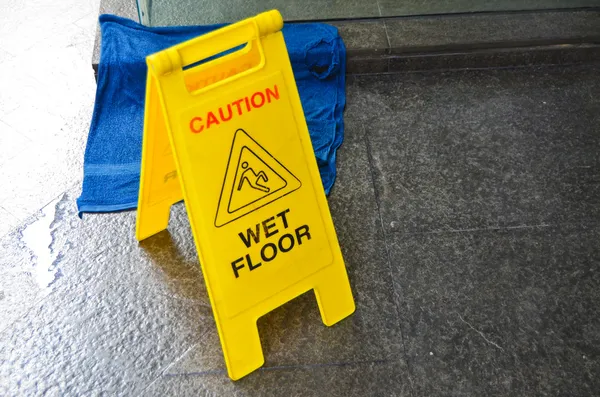 Caution wet floor warning sign — Stock Photo, Image