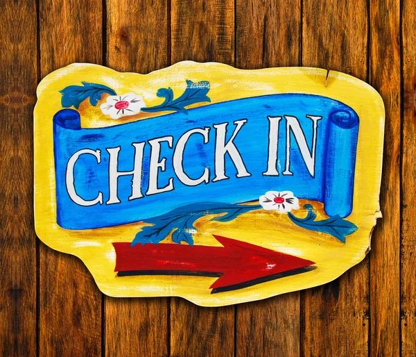 Check in letter wood board on wood background — Stock Photo, Image