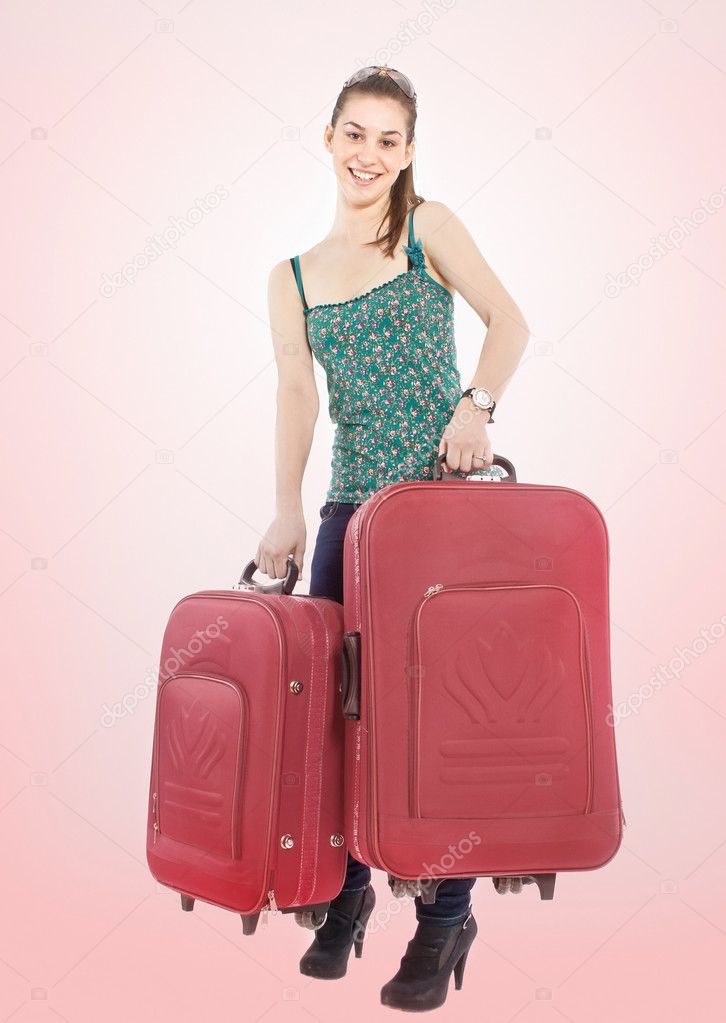 Beautiful girl with a travel bags