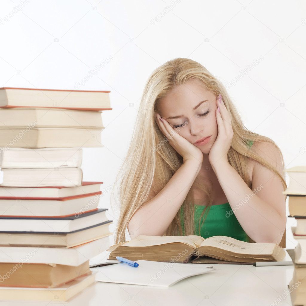 Young adult caucasian woman with books