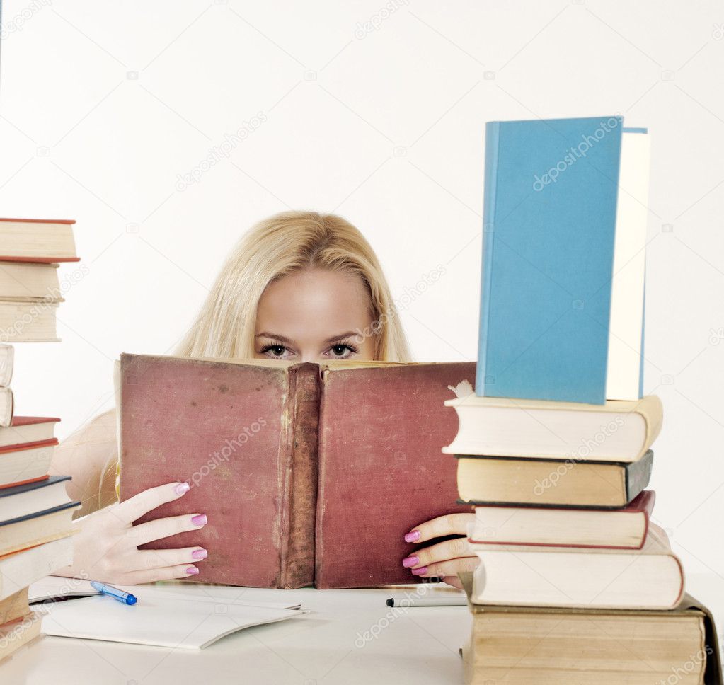 Girl hiding behind the book,