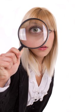 Close-up woman looking through magnifying glass clipart