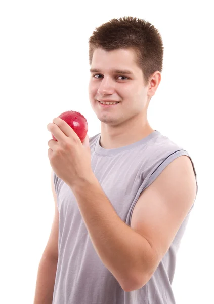 Rode appel in de hand van de man — Stockfoto