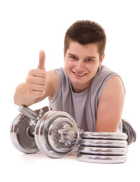 Young man exercising with a dumbbell — Stock Photo, Image