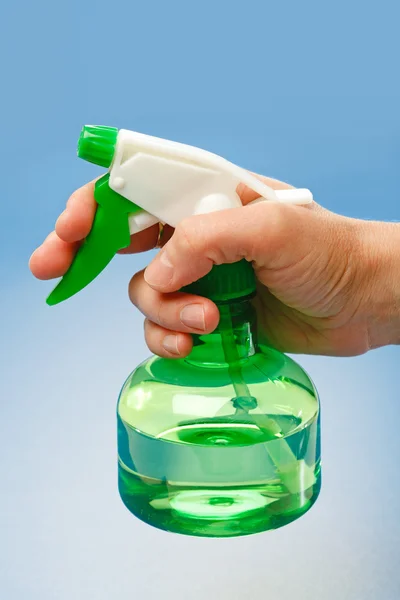 Hand holding water sprayer — Stock Photo, Image