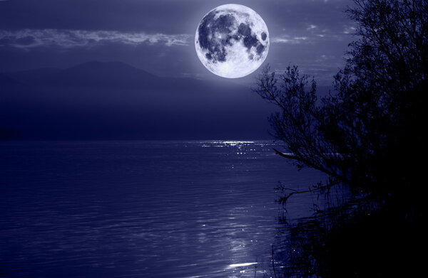 Big blue moon over water