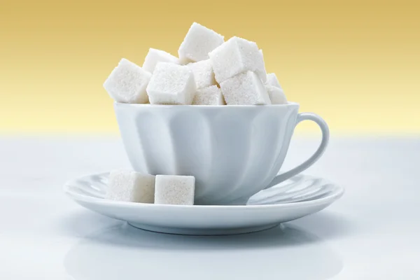 Tekopp med socker — Stockfoto