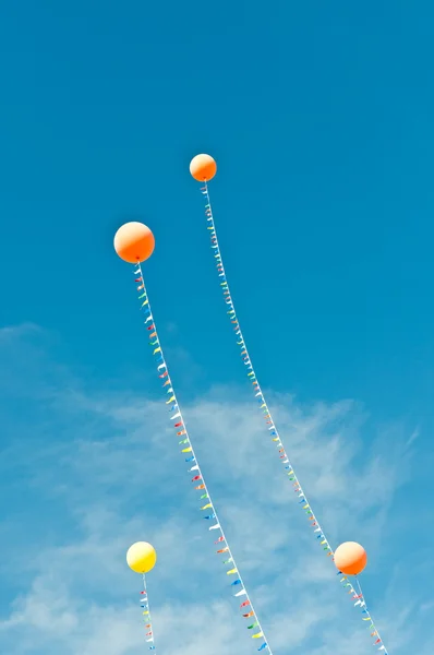Balloons with Streamers in a Blue Sky — Zdjęcie stockowe