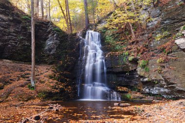 Autumn Waterfall in mountain. clipart