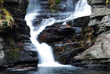 Autumn Waterfall in mountain clipart