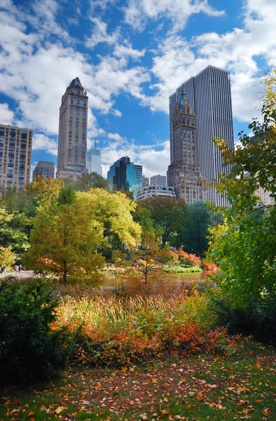 New York City Manhattan Central Park panorama in Autumn with colorful trees and skyscrapers.