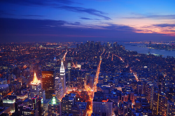 New York City Manhattan skyline aerial view panorama at sunset with skyscrapers and street.