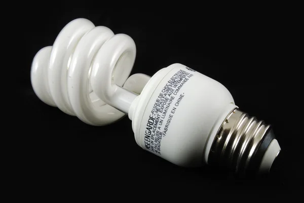 stock image Fluorescent bulb with black background