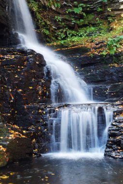 Autumn Waterfall in mountain clipart