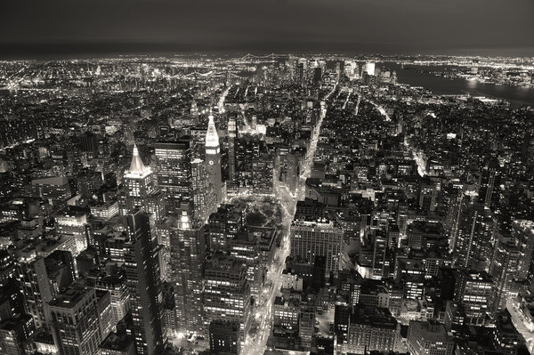New York City Manhattan aerial view at dusk with urban city skyline and skyscrapers buildings black and white
