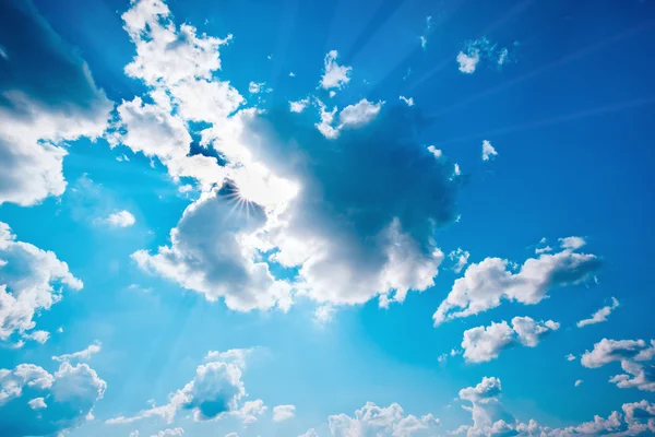 Blue sky with clouds and sun. — Stock Photo, Image