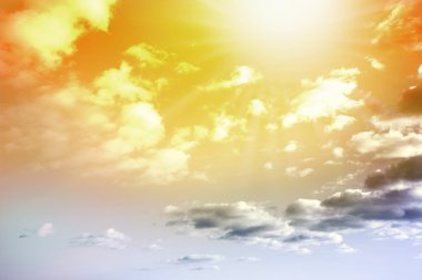 Sun shining brightly in summer sky clipart