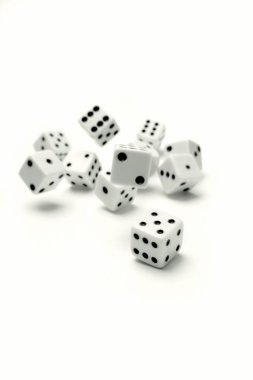 Dice rolling on white background clipart