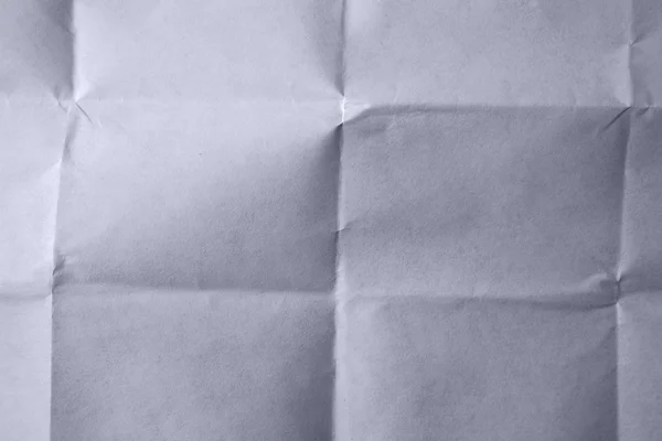 Zbliżenie fałdy w niebieskim papierze — Zdjęcie stockowe