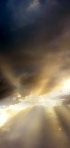 Sunrays piercing through clouds